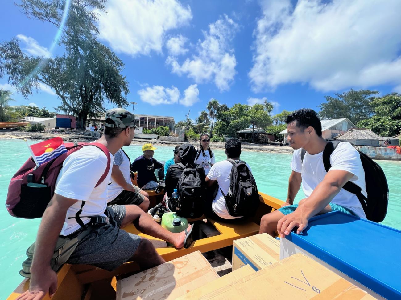 Members of KIRIMAT aboard a boat during a simulation exercise conducted in South Tarawa, Kiribati. Photo: WHO/Sean Casey